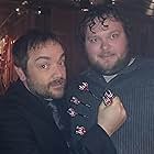 Playing a game of darts with Mark Sheppard on the set of "Supernatural."