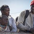 Malaika Wakoli-Abigaba, Wunmi Mosaku, and Sope Dirisu in His House (2020)