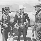 Roy Rogers, Dennis Hoey, Francis McDonald, and Trigger in Roll on Texas Moon (1946)