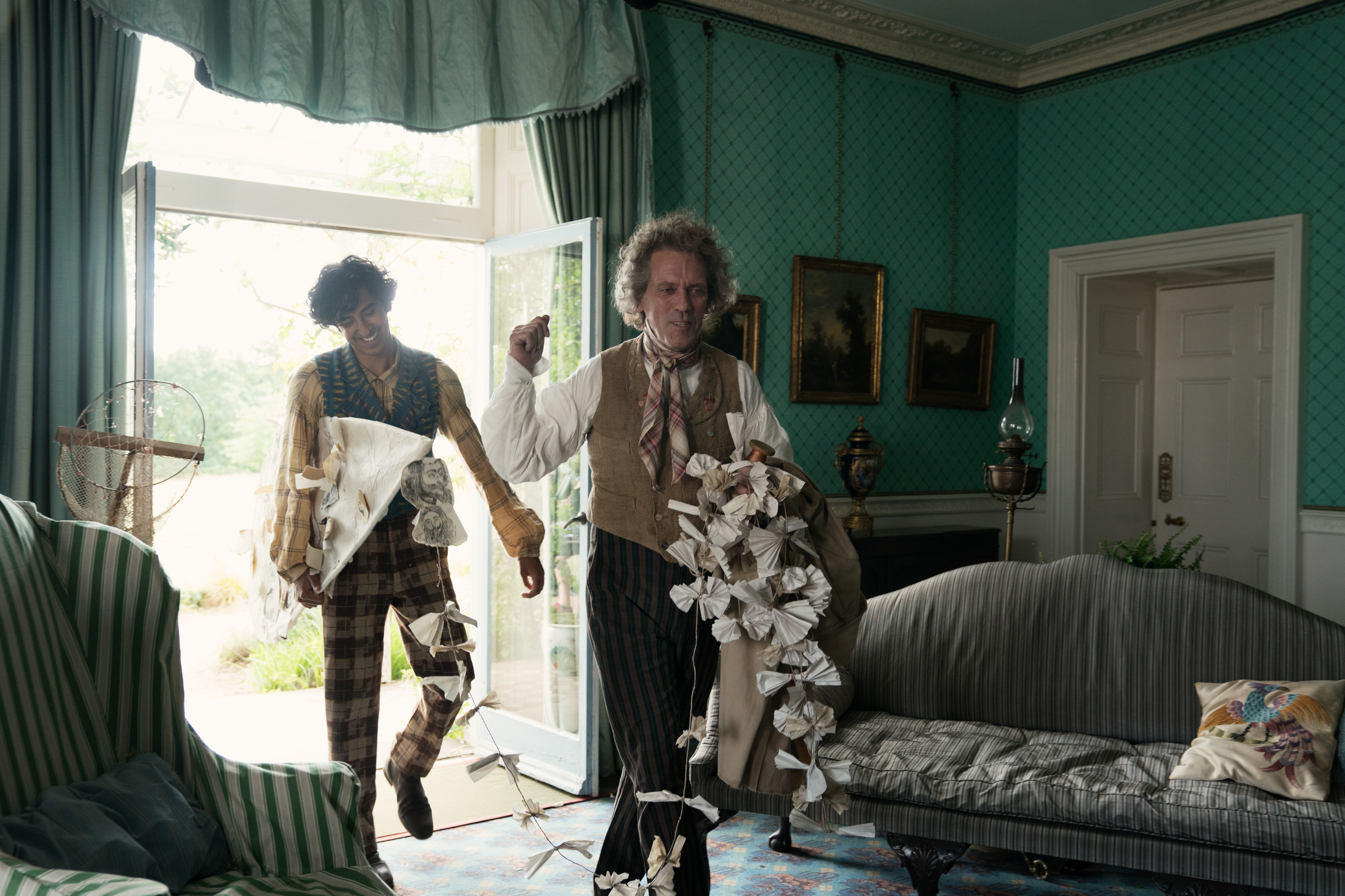 Hugh Laurie and Dev Patel in The Personal History of David Copperfield (2019)