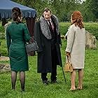 Jason Flemyng, Polly Walker, and Paloma Faith in Pennyworth (2019)