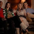 Robert Buckley, Antwon Tanner, Hilarie Burton Morgan, and Danneel Ackles in The Christmas Contract (2018)