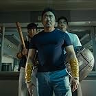 Gong Yoo, Ma Dong-seok, and Choi Woo-sik in Train to Busan (2016)