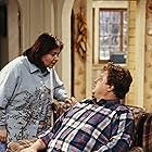 John Goodman and Roseanne Barr in Roseanne (1988)