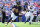 Chicago Bears rookie quarterback Caleb Williams rolls to his right during a preseason contest against the Buffalo Bills.