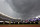 NEW YORK, NY - AUGUST 4: Members of the grounds crew put the tarp on the field as storm clouds cover Yankee Stadium during the eighth inning as Toronto Blue Jays takes on the New York Yankees on August 4, 2024 in New York City. (Photo by Adam Hunger/Getty Images)