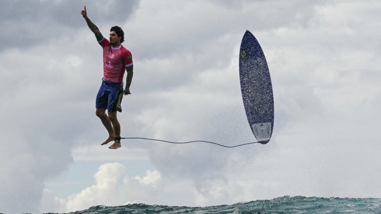 Brazil's Gabriel Medina reacts after his monster 9.90 score in the 5th heat of the men's surfing round 3 on the French Polynesian Island of Tahiti on July 29.