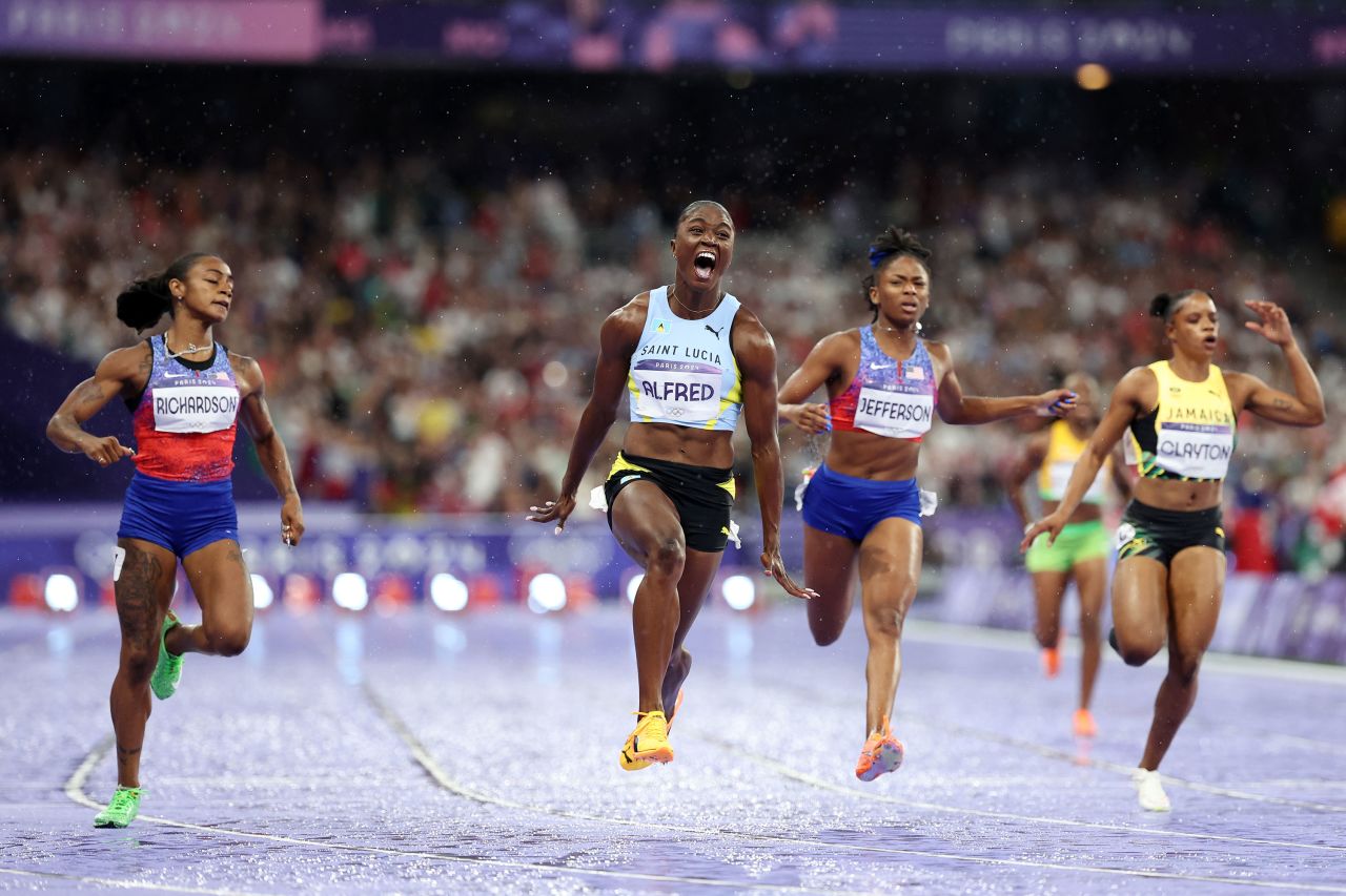 Julien Alfred of Saint Lucia crosses the finish line to win the women's 100-meter final Saturday. 