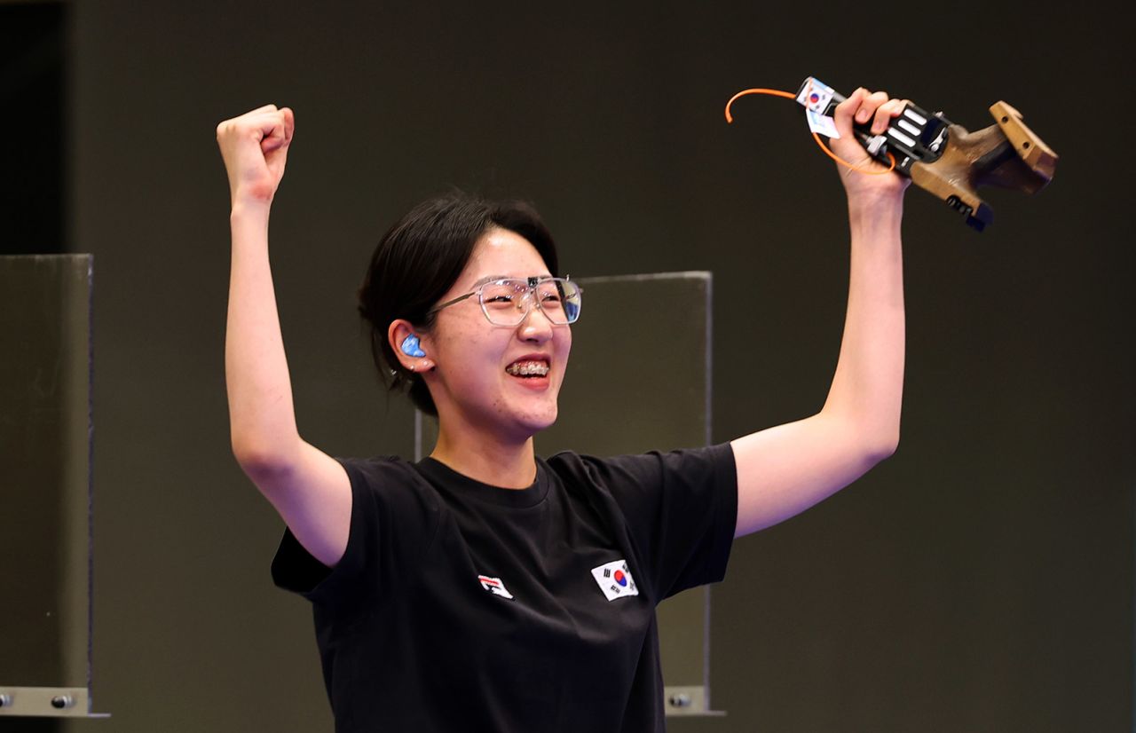 Jiin Yang of Team Republic of Korea celebrates winning the gold medal in the shooting 25m pistol women's final on August 3.