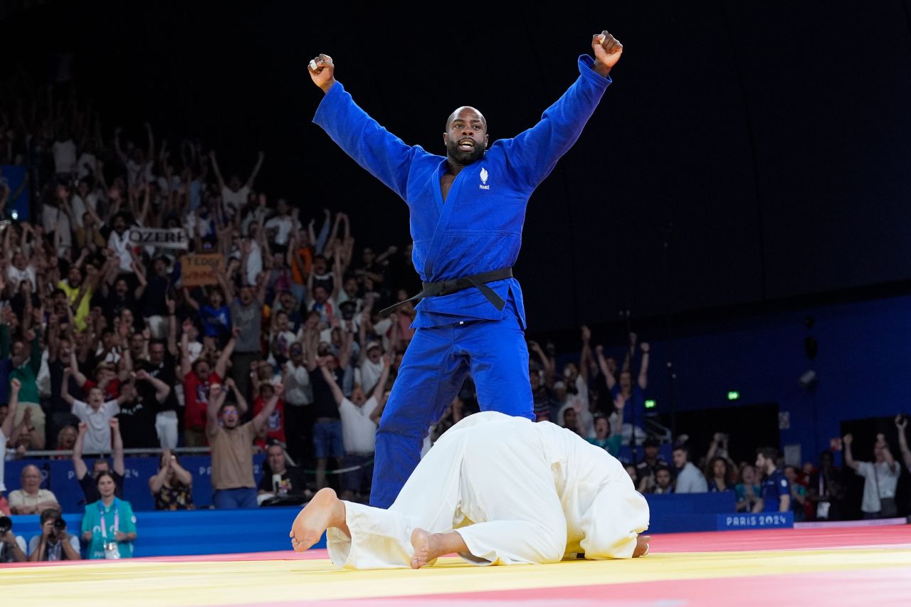 France's Teddy Riner celebrates after defeating Kim Min-jong of South Korea during their men's +100 kg final in the team judo competition Friday. 