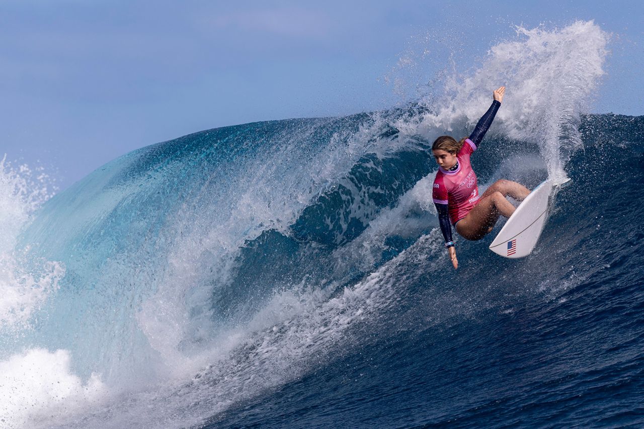 Caroline Marks rides a wave during the quarterfinals of surfing on August 01.