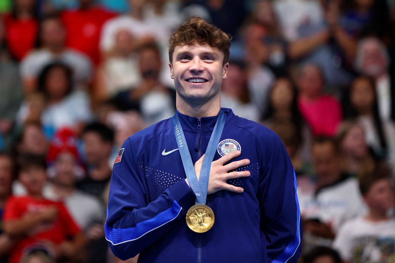 American swimmer Bobby Finke stands on the podium after winning the gold medal in the men's 1500-meter freestyle final Sunday. 