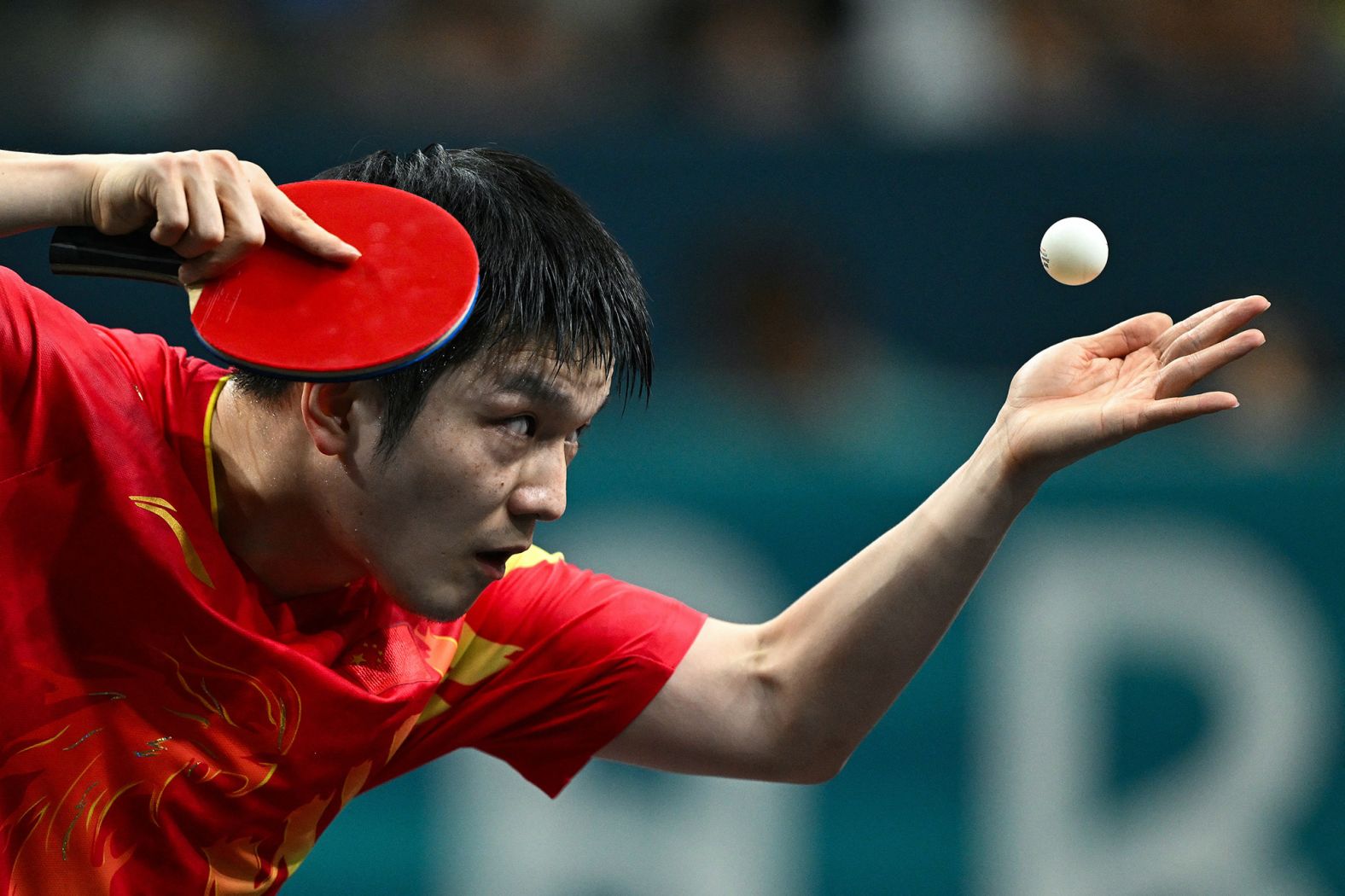 Chinese table tennis player Fan Zhendong serves to Sweden’s Truls Möregårdh during the final of men's singles on August 4. <a href="https://www.cnn.com/sport/live-news/paris-olympics-news-2024-08-04#h_67fb979428e918ce0a6a74ab9201edf8"