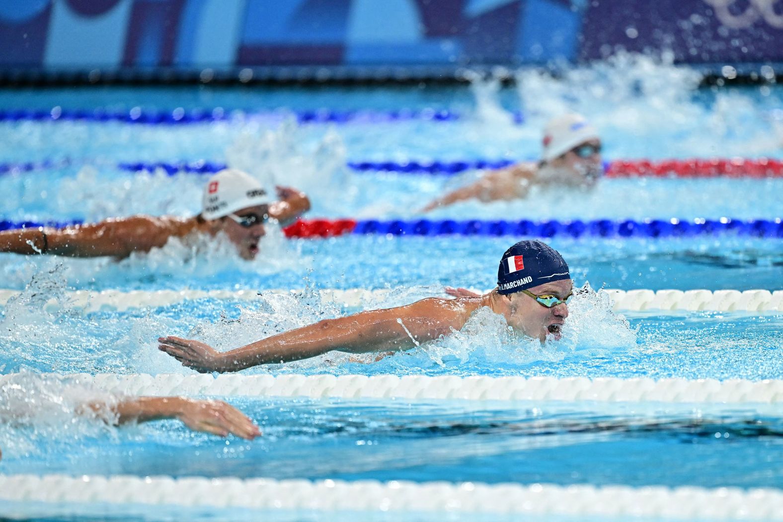 France's Léon Marchand leads the 200-meter butterfly final on July 31. <a href="https://www.cnn.com/sport/live-news/paris-olympics-news-2024-07-31#h_808414b823b308fc5e9233764590b359"