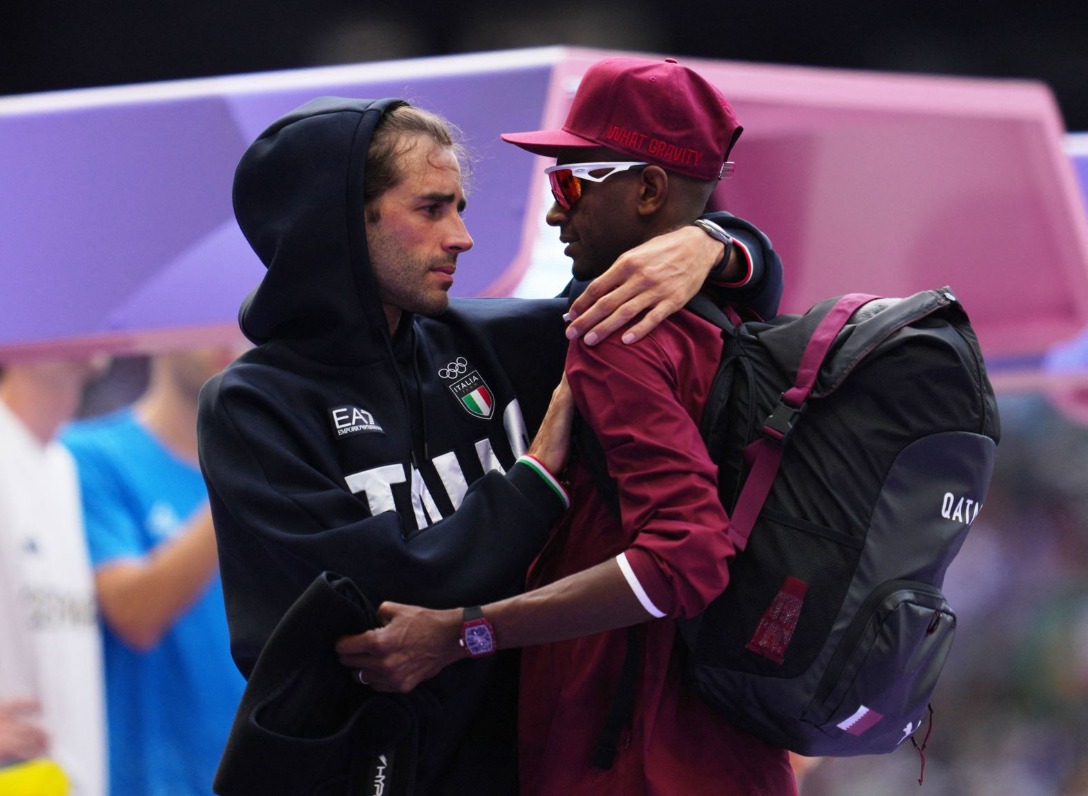 Italian high jumper Gianmarco Tamberi, left, speaks with Qatar's Mutaz Essa Barshim during the qualification round on August 7. The two shared a gold medal in the event three years ago in Tokyo. When Barshim pulled up with an apparent injury in Paris, <a href="https://www.cnn.com/sport/live-news/paris-olympics-news-2024-08-07#h_8ace76e36b6f5578104aedf12feead39"