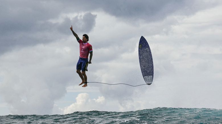 TOPSHOT - Brazil's Gabriel Medina reacts after getting a large wave in the 5th heat of the men's surfing round 3, during the Paris 2024 Olympic Games, in Teahupo'o, on the French Polynesian Island of Tahiti, on July 29, 2024. (Photo by Jerome BROUILLET / AFP) (Photo by JEROME BROUILLET/AFP via Getty Images)