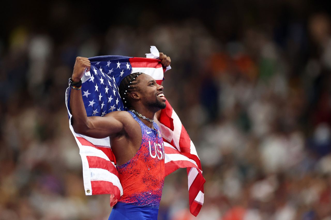 American sprinter Noah Lyles celebrates winning the gold medal in the men's 100-meter race Sunday. 