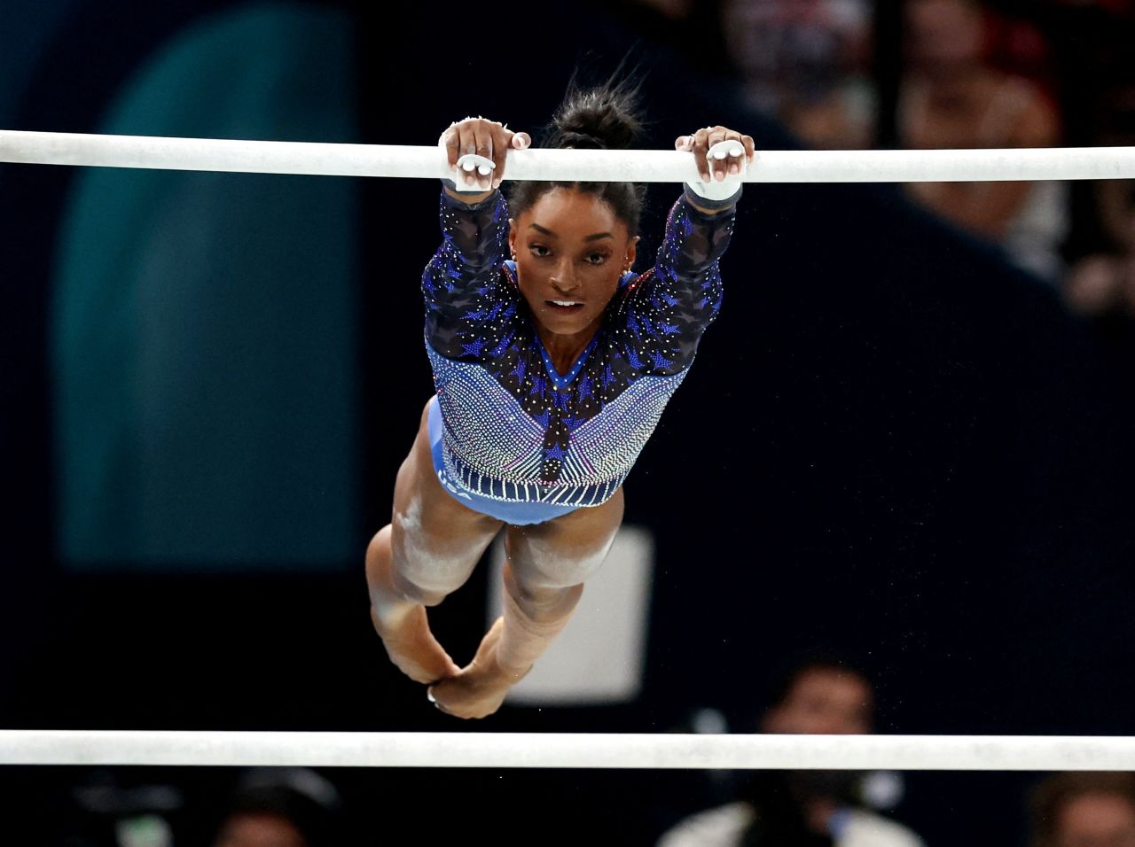 Simone Biles in action on the uneven bars.