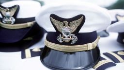 Coast Guard hats seen during a commencement ceremony.