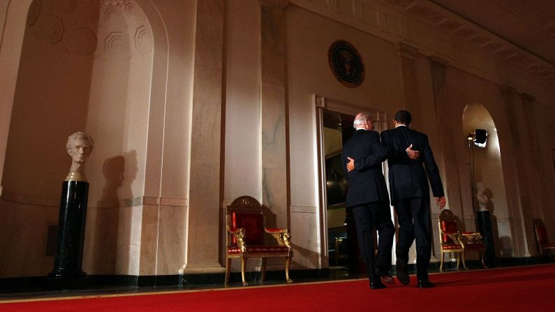 Biden and Obama put their arms around each other after Obama's <a href="http://www.cnn.com/2010/POLITICS/03/23/health.care.main/" target="_blank"