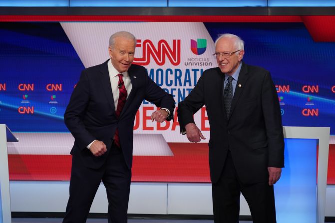 Biden greets US Sen. Bernie Sanders with an elbow bump before the start of <a href="http://www.cnn.com/2020/03/15/politics/gallery/debate-washington-biden-sanders/index.html" target="_blank"