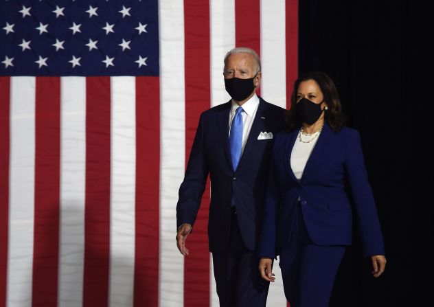 Biden and Harris walk out for <a href="http://www.cnn.com/2020/08/12/politics/gallery/joe-biden-kamala-harris-first-appearance/index.html" target="_blank"