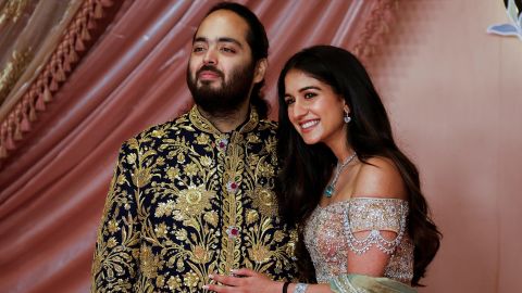 Anant Ambani, son of businessman Mukesh Ambani, poses with his fiance Radhika Merchant on the red carpet during the sangeet ceremony at Jio World Centre, Mumbai, India, July 5, 2024. REUTERS/Francis Mascarenhas