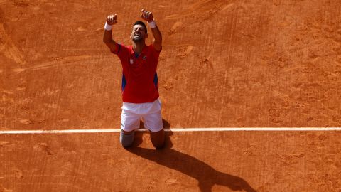 Paris 2024 Olympics - Tennis - Men's Singles Gold Medal Match - Roland-Garros Stadium, Paris, France - August 04, 2024. Novak Djokovic of Serbia celebrates after winning gold against Carlos Alcaraz of Spain.