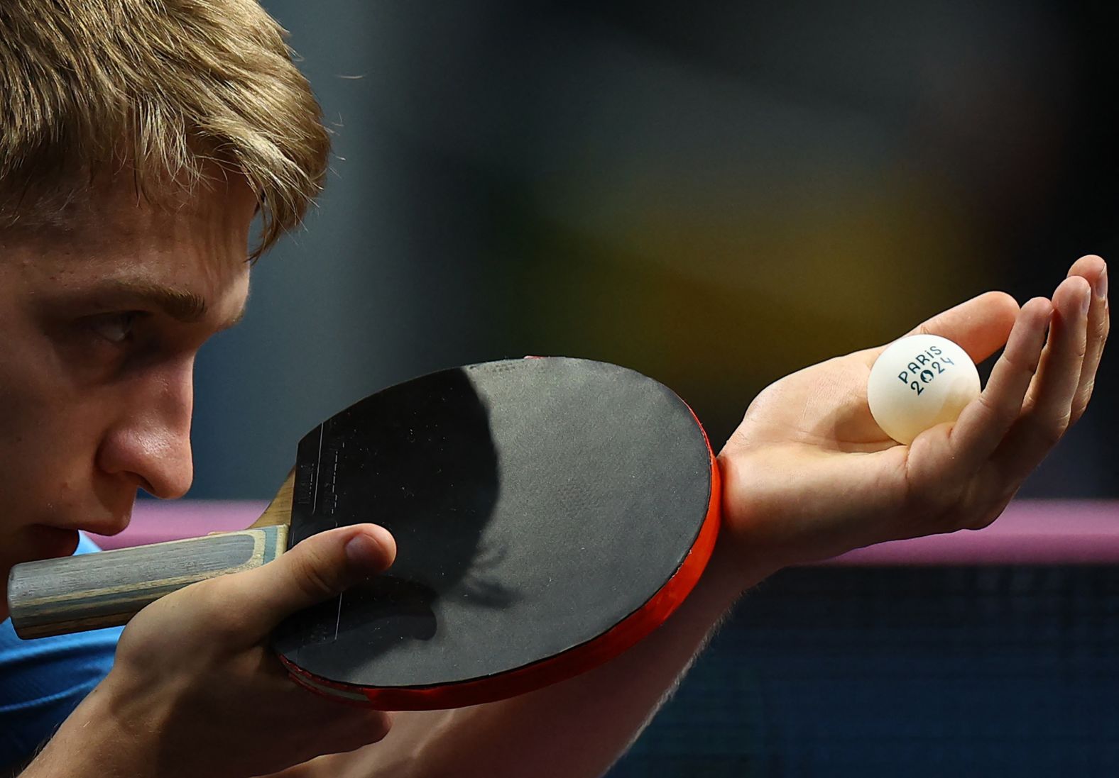 Swedish table tennis player Anton Källberg prepares to serve during a semifinal match on August 7.