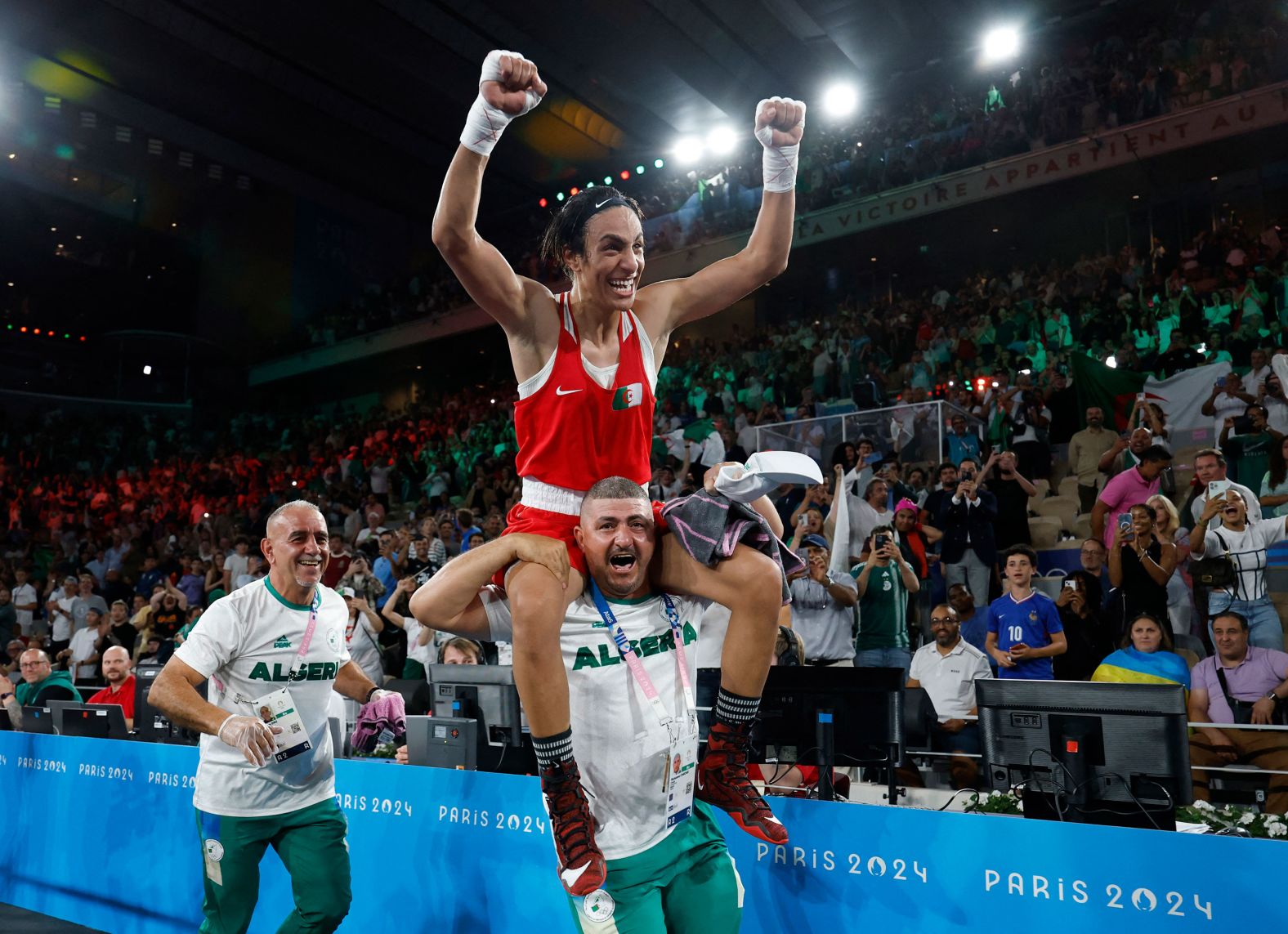 Algerian boxer Imane Khelif celebrates after <a href="https://www.cnn.com/sport/live-news/paris-olympics-news-2024-08-09#h_d73db158fa0a20eff75fd6c7759d6e00"