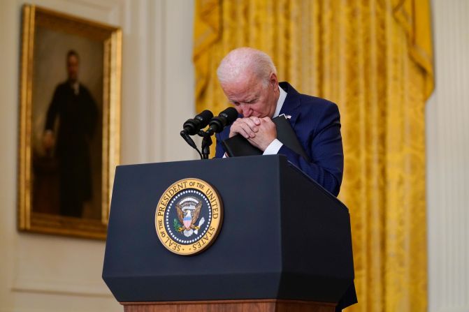 Biden pauses as he listens to a question about <a href="https://www.cnn.com/2021/08/26/middleeast/gallery/kabul-deadly-blasts-afghanistan-airport/index.html" target="_blank"