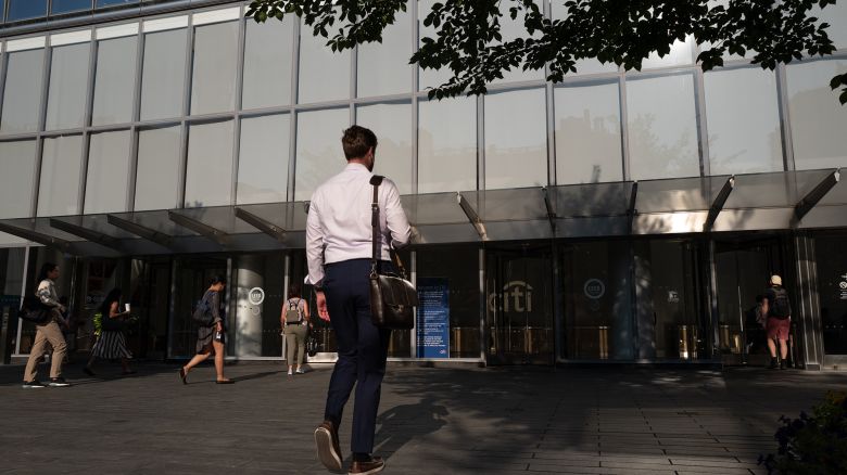 Workers enter Citigroup headquarters in New York, US, on Thursday, Aug. 4, 2022. 