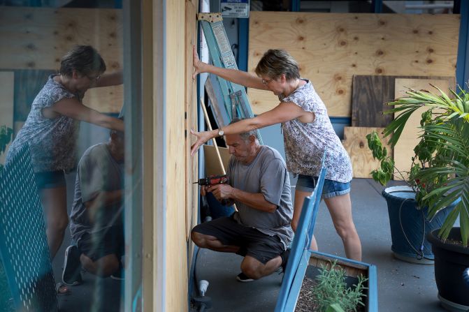 Frederic and Mary Herodet board up their Gulf Bistro restaurant in St. Pete Beach, Florida, on Tuesday.