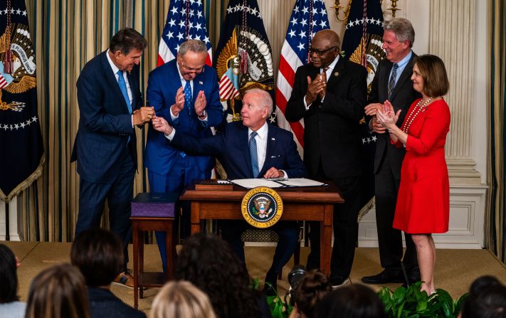 Biden hands West Virginia Sen. Joe Manchin the pen used to sign the <a href="https://www.cnn.com/2022/08/16/politics/biden-inflation-reduction-act-signing/index.html" target="_blank"