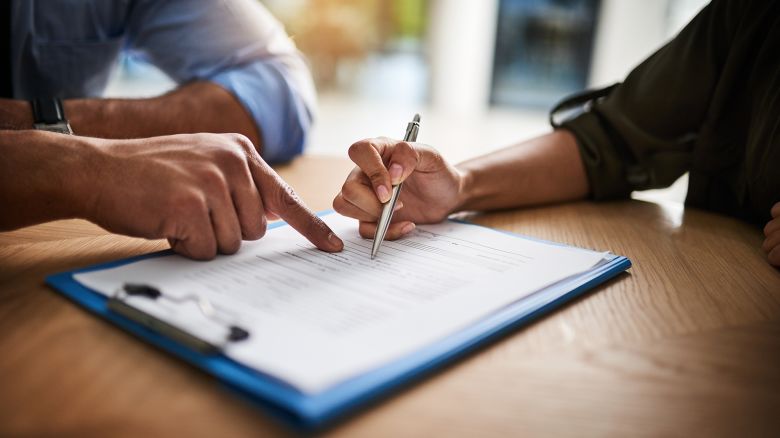 02 employee signing documents STOCK