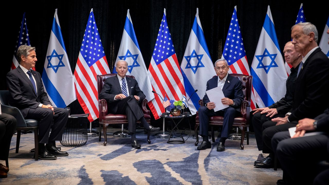 U.S. President Joe Biden, center left, pauses during a meeting with Israeli Prime Minister Benjamin Netanyahu, center right,  in Tel Aviv, Israel, Wednesday, Oct. 18, 2023. At left: U.S. Secretary of State Antony Blinken; at right: Minister of Defense Yoav Gallant, second right and lawmaker Benny Gantz, right.  (Miriam Alster/Pool Photo via AP)