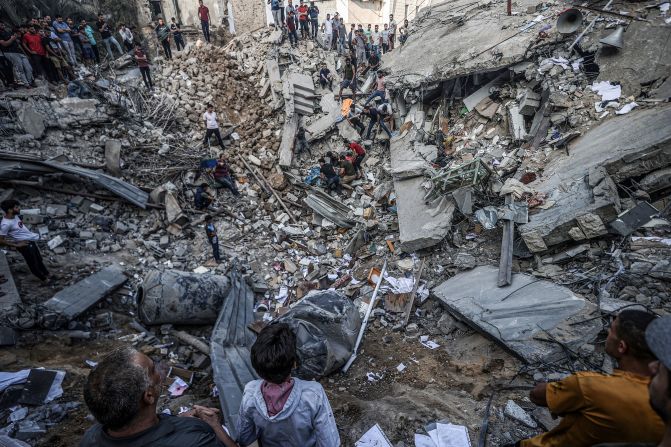 Civil defense teams and residents continue search and rescue efforts at a Greek Orthodox church after an Israeli airstrike in Gaza City on October 20.