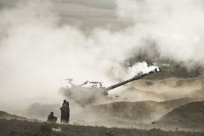 An Israeli mobile artillery unit fires a shell from southern Israel towards Gaza on October 25.<br /