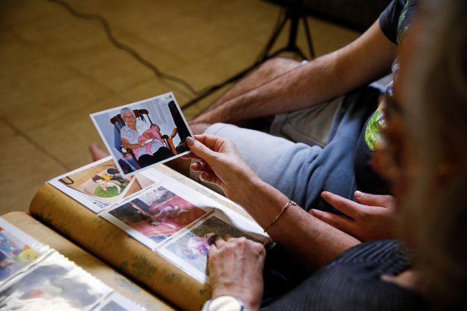 Neta Heiman, a peace activist, holds a photograph of her mother, Ditza Heiman, who is being held hostage by Hamas, in Haifa, Israel on Thursday, November 2.