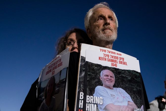 In Tel Aviv on November 7, people hold photos of people who were kidnapped by Hamas and taken to Gaza.