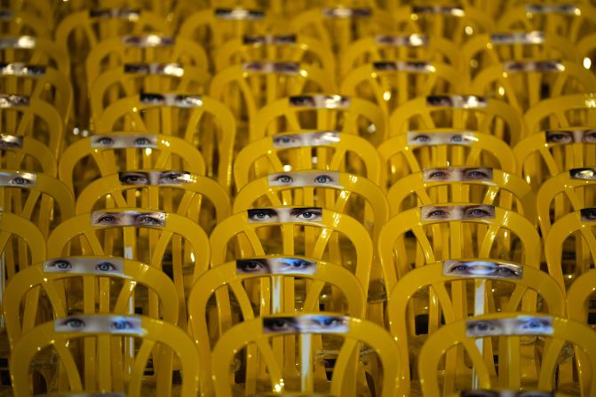 Images of people's eyes adorn chairs, one for each of the 240 Israelis held hostage by Hamas in Gaza, which are placed outside The Museum of Modern Art known as the 'The Hostages and Missing Square' on November 11, in Tel Aviv, Israel.