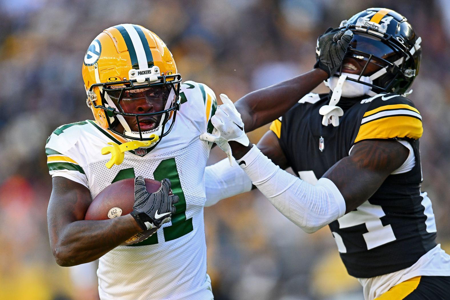 Green Bay Packers wide receiver Jayden Reed stiff arms Joey Porter Jr. of the Pittsburgh Steelers on November 12. The Steelers beat the Packers 23-19.