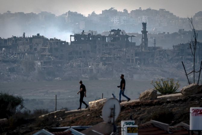 Men walk along the border of Gaza in southern Israel on November 13.