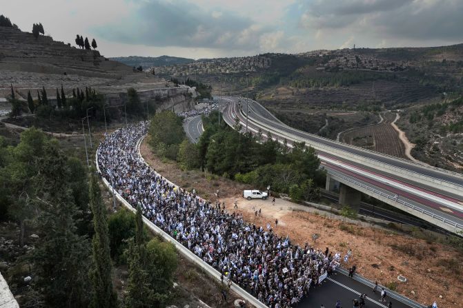 Tens of thousands of people led by the families of Hamas' hostages walk along Route 1 to enter Jerusalem on the <a href="https://edition.cnn.com/2023/11/18/world/netanyahu-hamas-hostages-israel/index.html" target="_blank"