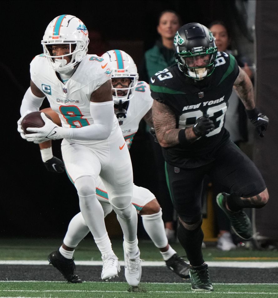 Miami Dolphins safety Jevon Holland runs the ball after intercepting New York Jets quarterback Tim Boyle's Hail Mary pass on the 1-yard line on Friday, November 24. Holland <a href="https://www.cnn.com/2023/11/25/sport/miami-dolphins-new-york-jets-nfl-spt-intl/index.html" target="_blank"