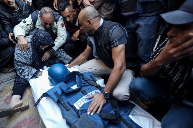 Relatives and friends bid farewell to the body of Al Jazeera camera operator <a href="https://www.cnn.com/2023/12/15/middleeast/al-jazeera-cameraman-dies-and-reporter-is-injured-in-israeli-airstrike-in-southern-gaza/index.html" target="_blank"