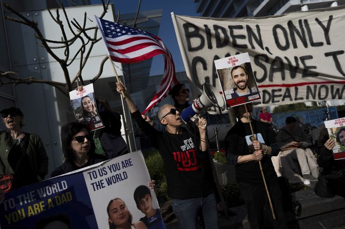 Families and supporters of Israeli hostages held by Hamas in Gaza hold signs and photos of their loved ones at a protest calling for their return, outside a meeting between U.S. Secretary of State Antony Blinken and Israeli President Isaac Herzog, in Tel Aviv, Israel, on January 9.