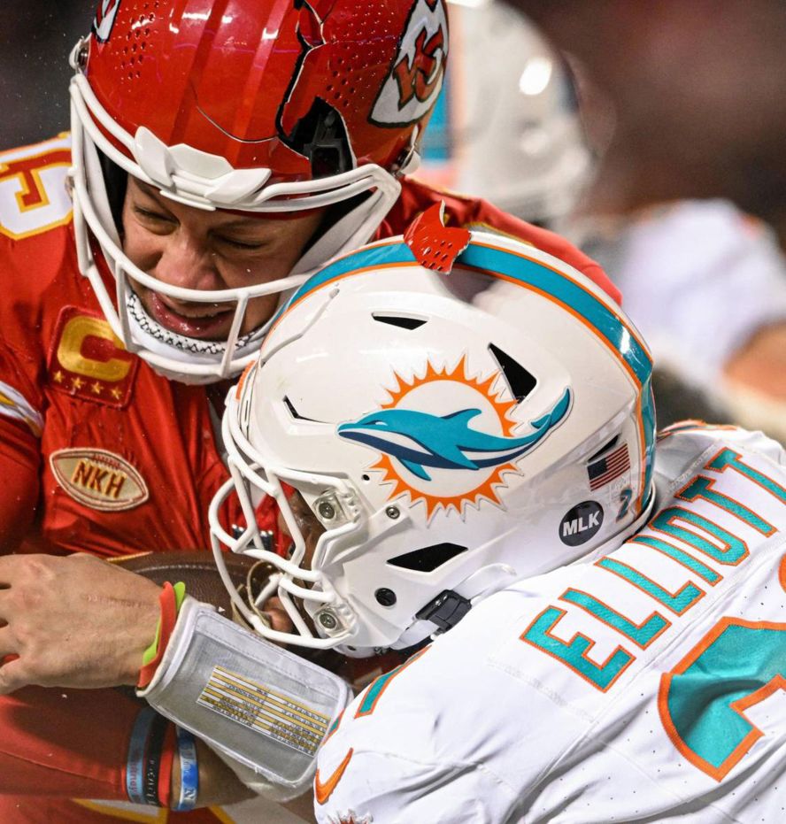 The helmet of Kansas City Chiefs quarterback Patrick Mahomes breaks as he is hit by Miami Dolphins safety DeShon Elliott during the <a href="https://www.cnn.com/2024/01/14/sport/kansas-city-chiefs-defeat-miami-dolphins-cold/index.html" target="_blank"