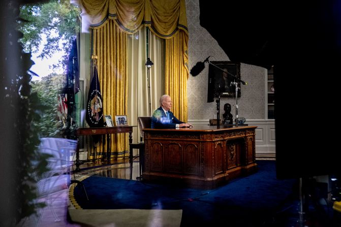 Biden, seen through a window, delivers his first-ever address from the White House Oval Office in June 2023. He declared bipartisanship alive and well as he <a href="https://www.cnn.com/2023/06/02/politics/biden-debt-oval-office-address/index.html" target="_blank"