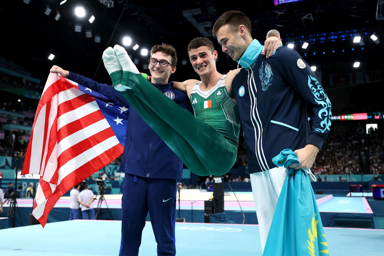 From left, USA’s Stephen Nedoroscik, Ireland’s Rhys McClenaghan and Kazakhstan’s Nariman Kurbanov pose for a photo after competing in the pommel horse final. 